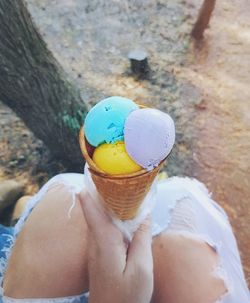 Person holding ice cream cone