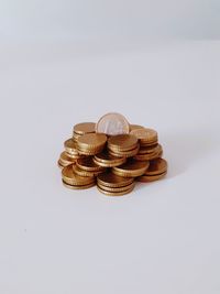 Close-up of coins on white background