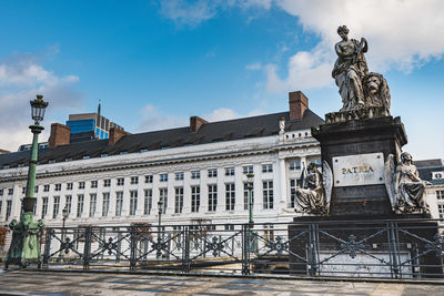 Low angle view of statue against building