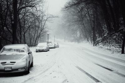 Cars on snow covered road