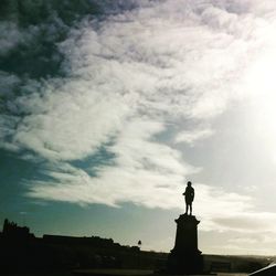 Low angle view of statue against cloudy sky