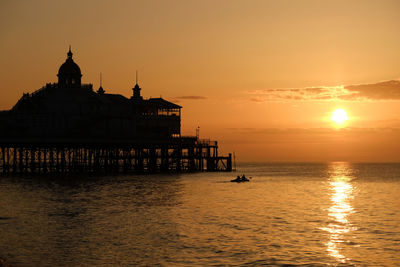 Silhouette of building at sunset