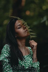 Portrait of young woman looking away