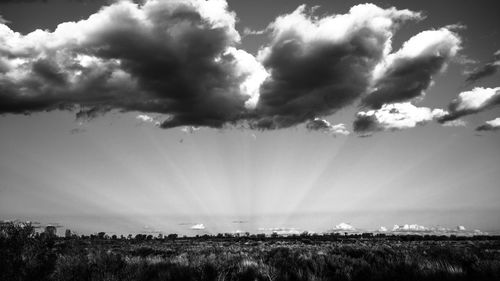 Scenic view of landscape against cloudy sky