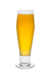 Close-up of beer glass against white background