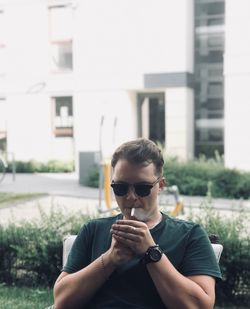 Young man smoking cigarette