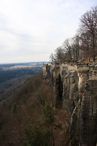 Rock formations on landscape against sky