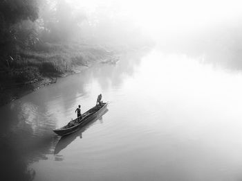 River activity in the morning fog