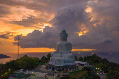 Statue against sky during sunset