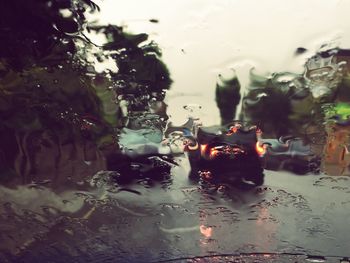 Close-up of wet car windshield during rainy season