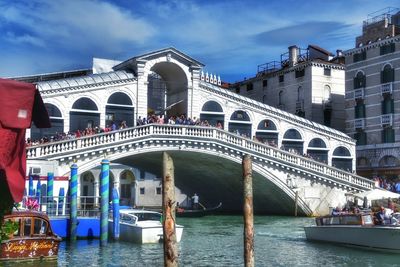 View of bridge over canal against cloudy sky