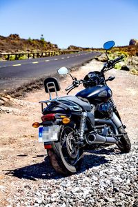 Close-up of motorcycle against sky