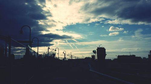 Built structure against cloudy sky at sunset