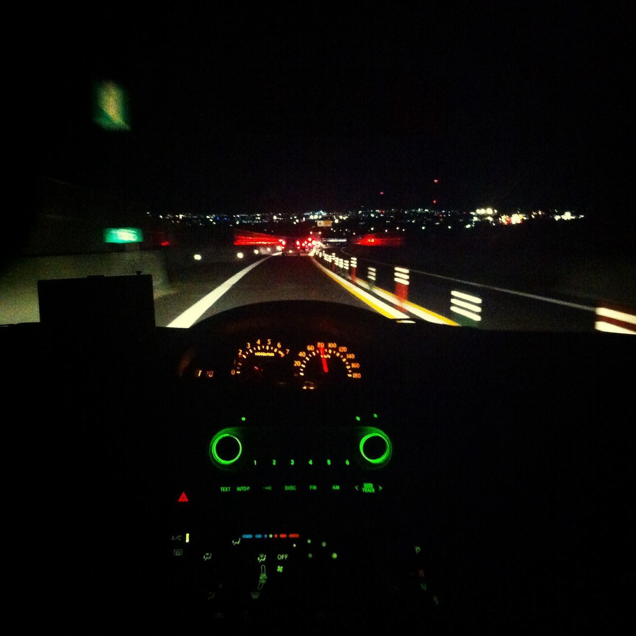 illuminated, night, transportation, car, mode of transport, land vehicle, traffic, lighting equipment, city, high angle view, road, street, light trail, light - natural phenomenon, tail light, dark, on the move, speed, indoors, travel