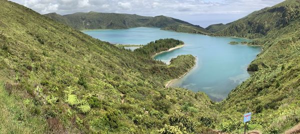 High angle view of lake and trees against sky