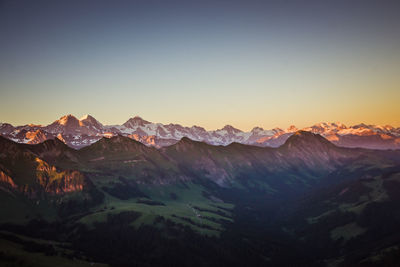 Scenic view of mountains against clear sky during winter