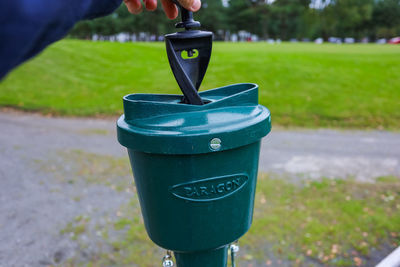 Close-up of coin-operated binoculars on field