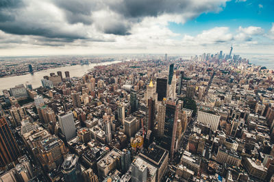 High angle view of modern buildings against sky in city