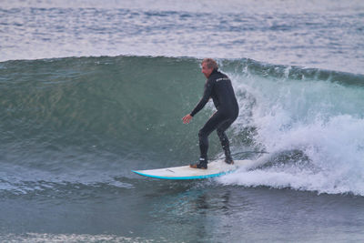 Full length of man surfing in sea