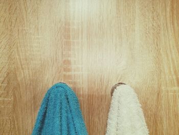 Close-up of cropped towels on wooden wall
