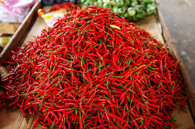 High angle view of red chili peppers at market for sale