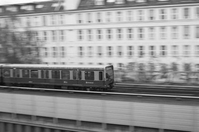 Train on railroad track in city