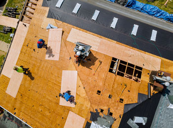 High angle view of people walking on road