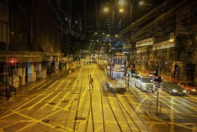 Cars on illuminated city at night