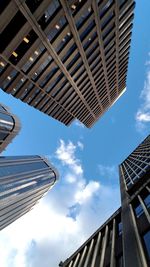 Low angle view of buildings against blue sky