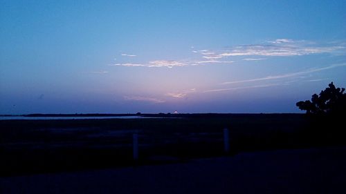 Scenic view of landscape against cloudy sky