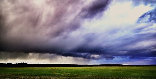 Scenic view of landscape against cloudy sky