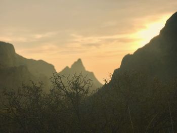 Scenic view of mountains against sky during sunset