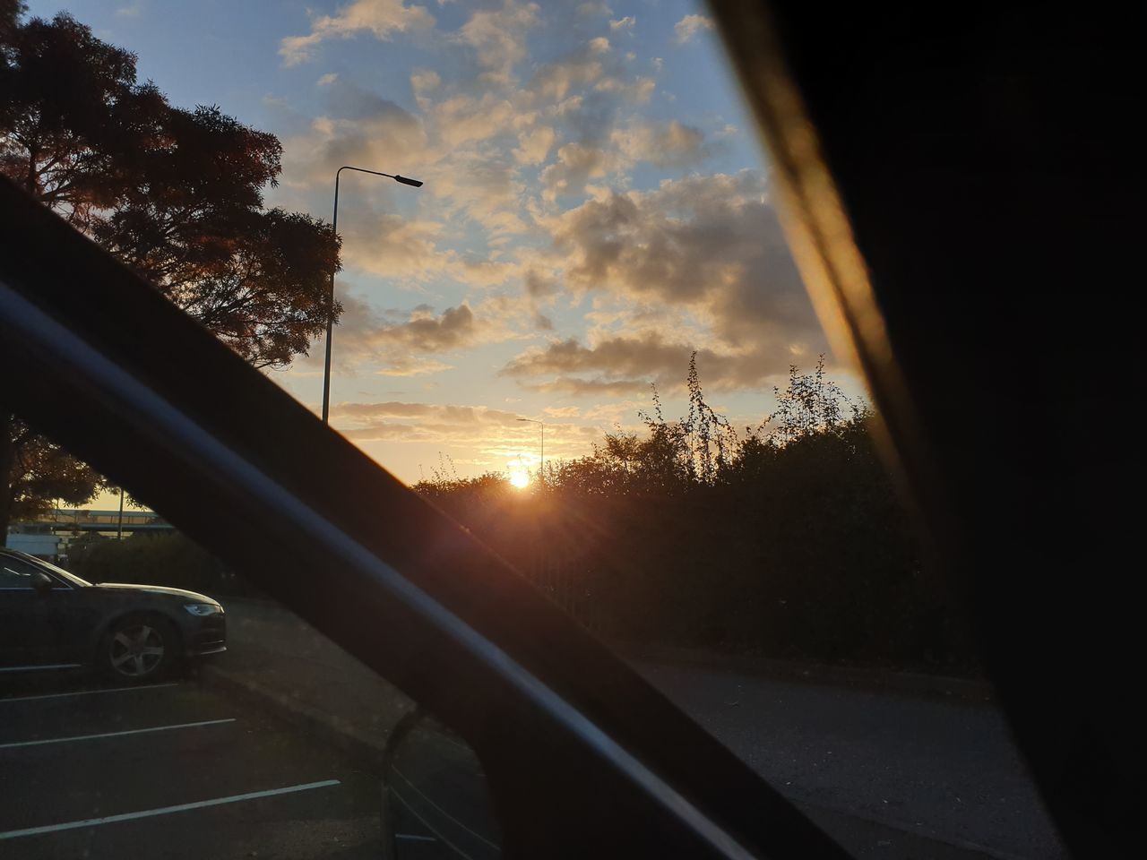 ROAD SEEN THROUGH CAR WINDOW