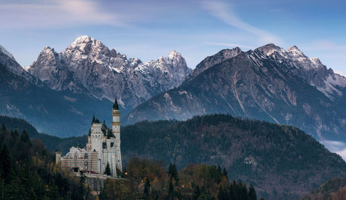 Historic church against mountains