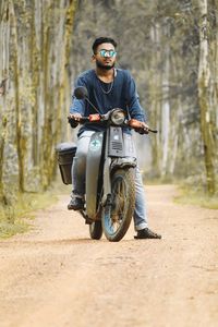 Man riding motorcycle on road