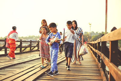 People walking on footbridge