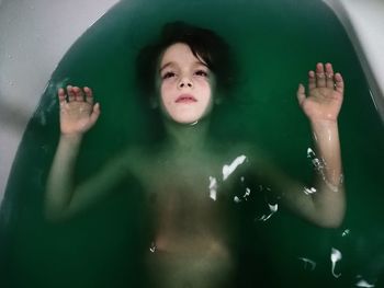 High angle view of boy playing in water