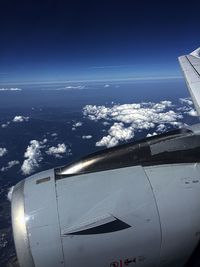 Aerial view of airplane flying over sea