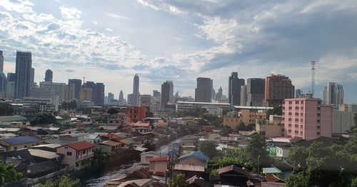 High angle view of buildings in city against sky