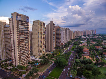 Modern buildings in city against sky