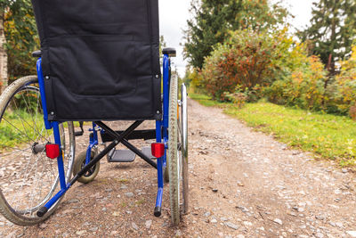 Rear view of people walking on footpath