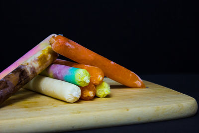 Close-up of multi colored candies on table