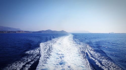 Scenic view of sea against clear blue sky