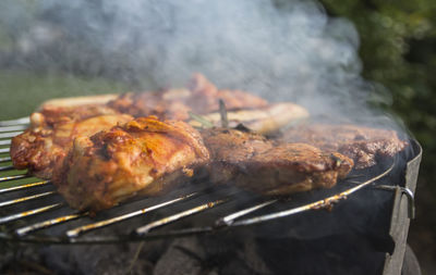 Close-up of meat on barbecue grill