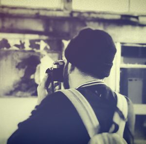 Young woman holding camera