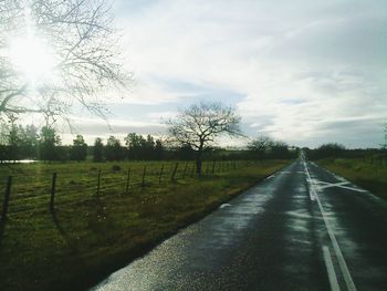 Road passing through field