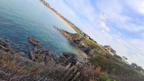 Panoramic view of sea and rocks against sky