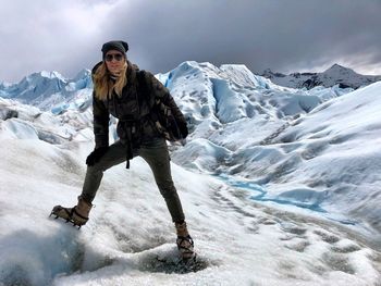 Portrait of woman standing on glacier 