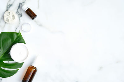 High angle view of white bottle on table