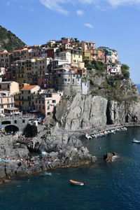 Town by sea against buildings